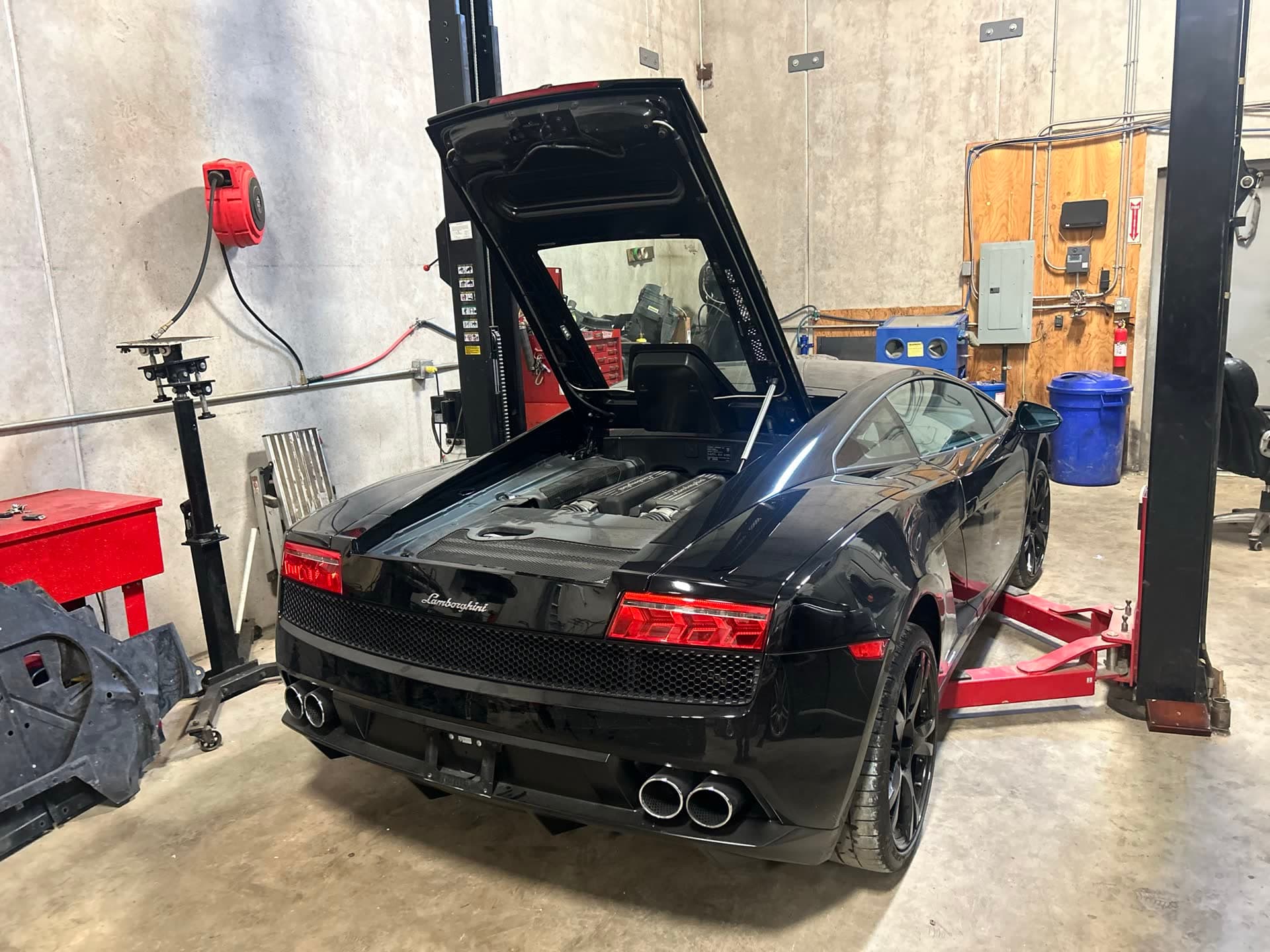 Black Lamborghini Gallardo in the bay